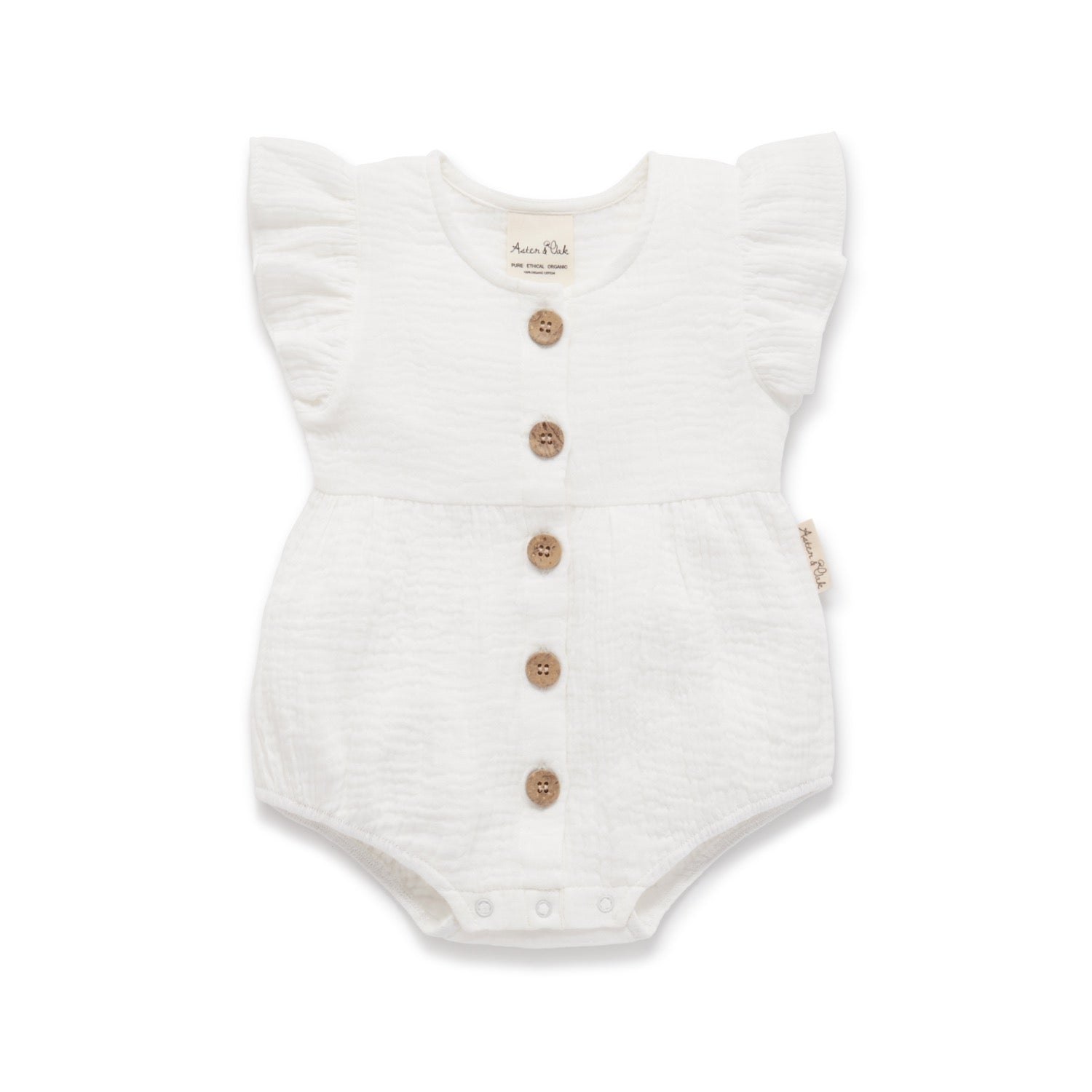 White baby romper with button details on a white background