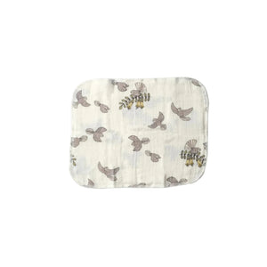 Baby muslin washcloths with bird pattern on a white background