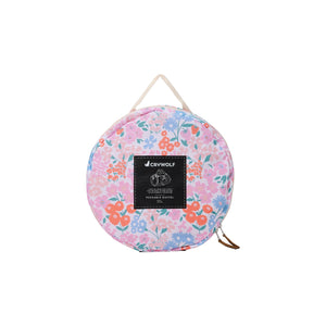 Floral-patterned bag with a visible brand logo on a white background