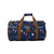 Blue duffel bag with brown handles and trim on a white background