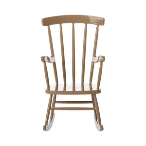 Metal rocking chair with a white cushion on a white background