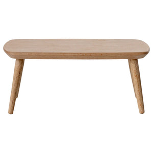 Wooden coffee table with four legs on a white background