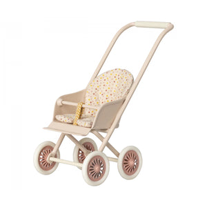 Beige and pink baby stroller with a patterned seat on a white background