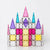 Colorful castle-shaped glass ornament on a white background