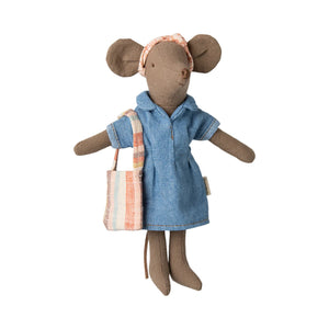 Stuffed mouse doll in a blue dress holding a striped bag on a white background