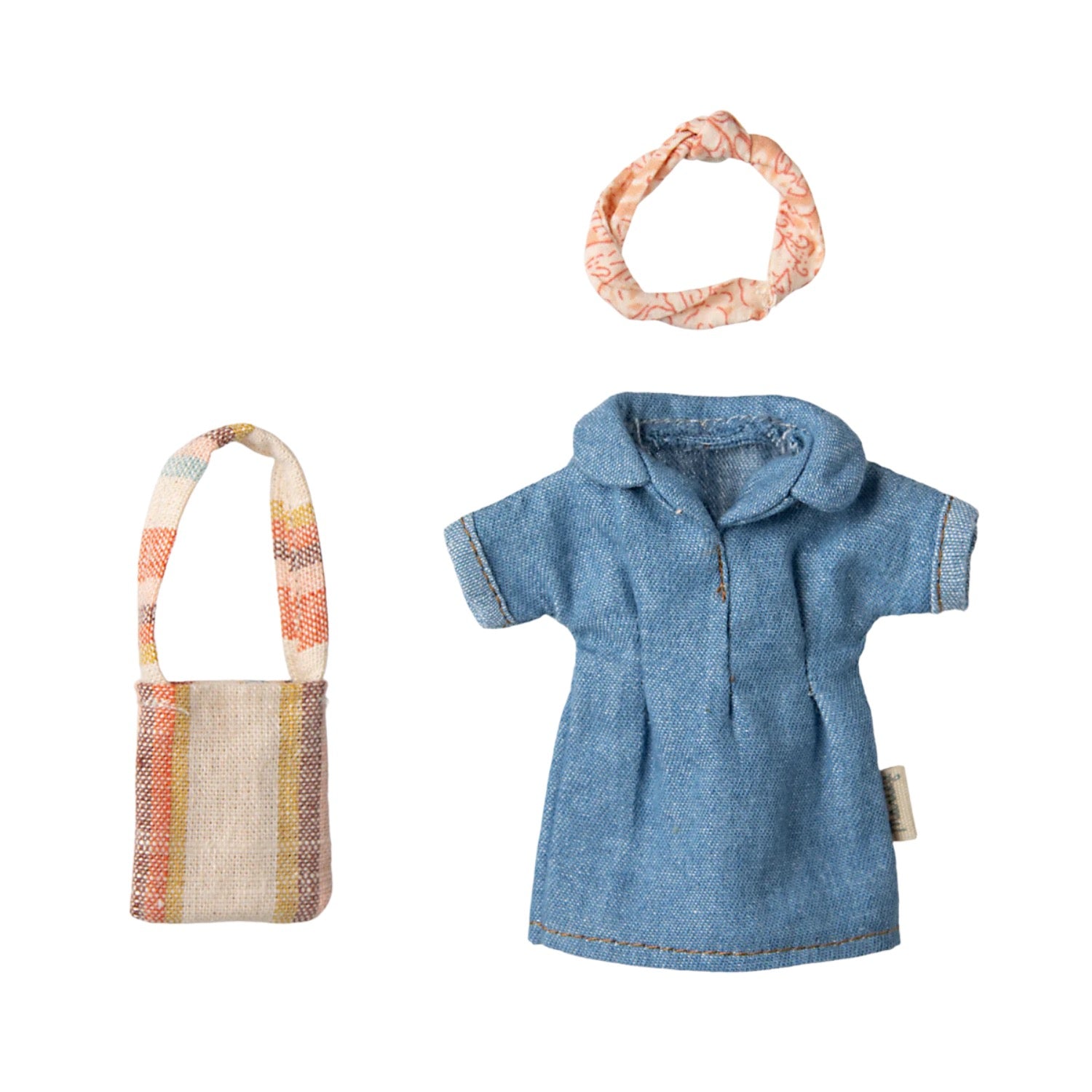 Denim dress, bag, and headband set on a white background