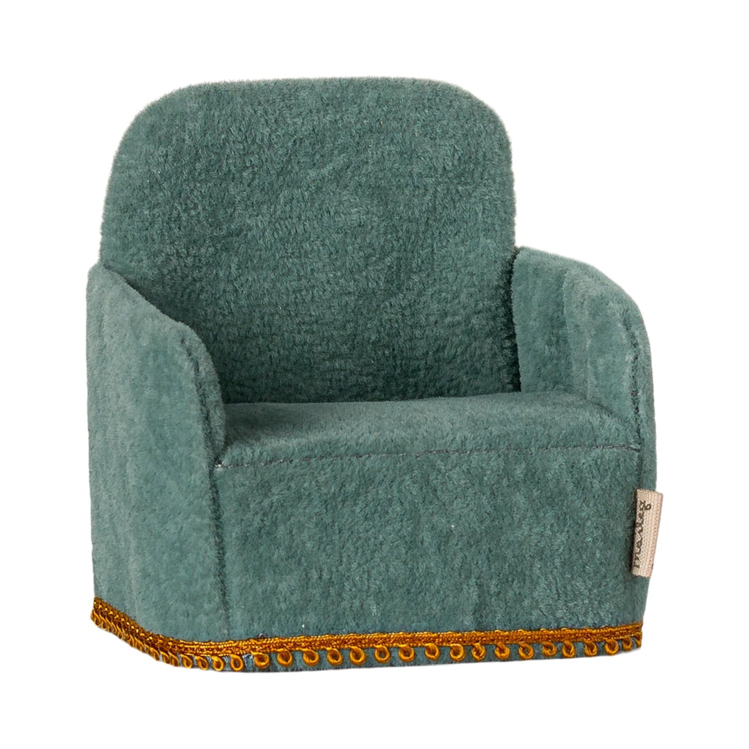 Green plush armchair with gold trim on a white background