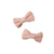 Two pink muslin bow hair clips on a white background by Nature Baby