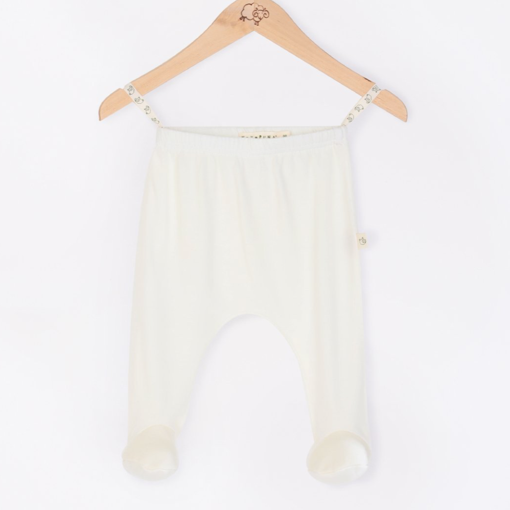 Mokopuna Merino footed pants in cream Lily color