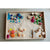Grapat wooden tray filled with sand and colourful natural toys to invite play